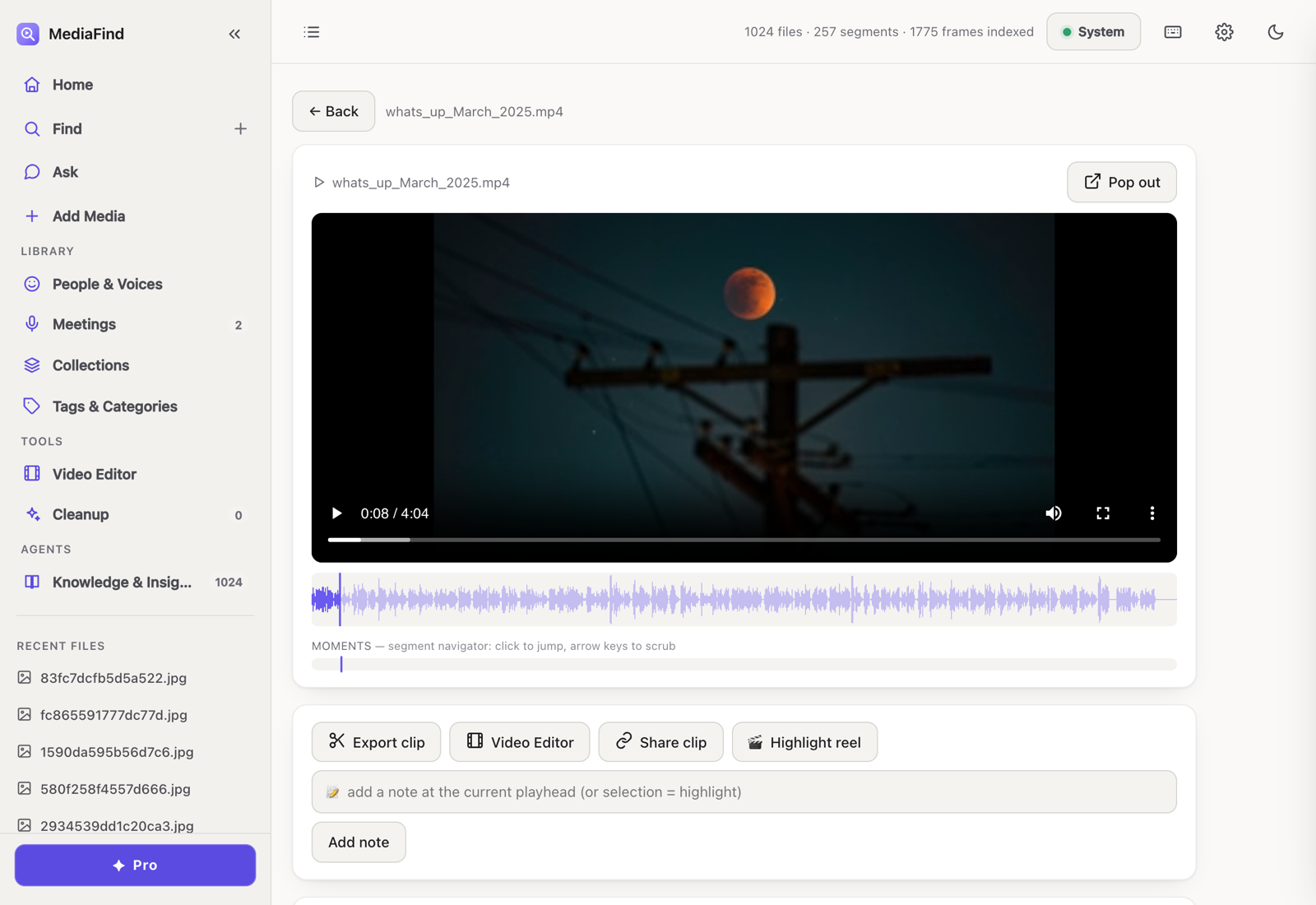 The player view: a video paused on a frame, a 'Moments' segment navigator shown as a waveform you can click to jump, and actions to export a clip, open the video editor, share, or build a highlight reel.